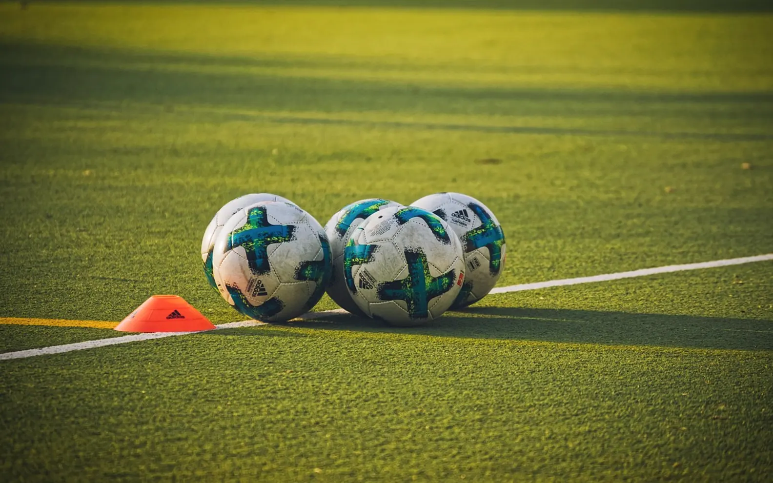 Footballs, balls and sports